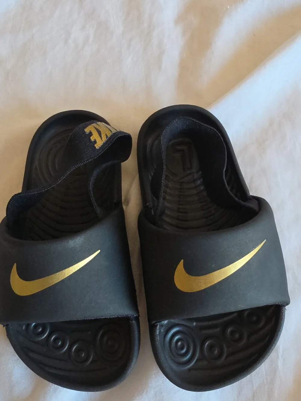 Nike Toddler Black Slide Sandals with Gold Swoosh